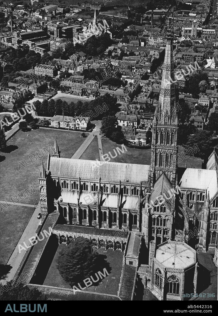 Salisbury Cathedral Being Repaired -- The five steeple jacks want to speed things up a bit so they're building an electric railway on a cathedral's spire. The men are helping to repair the most famous and the tallest spire in England that of Salisbury Cathedral. The top 25ft of the spire is to be taken down and rebuilt. the first 220ft. are scaled by inside spiral stairs. The railway climbs dizzily from the top of the square tower to the scaffolding 184ft. further on. It will be used to lower tons of masonry and the 9ft. iron cross which surmounts the spire. June 05, 1950.