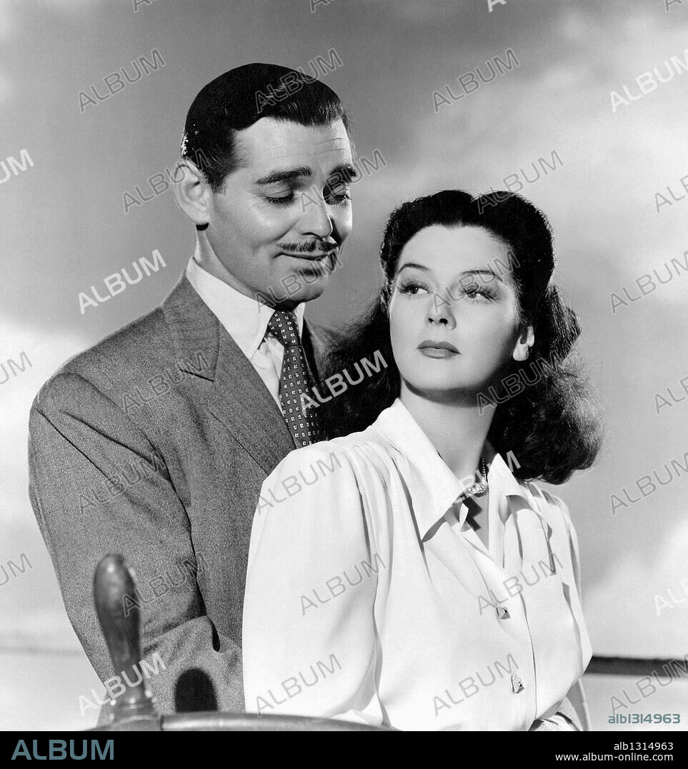 CLARK GABLE and ROSALIND RUSSELL in THEY MET IN BOMBAY, 1941, directed by CLARENCE BROWN. Copyright M.G.M.