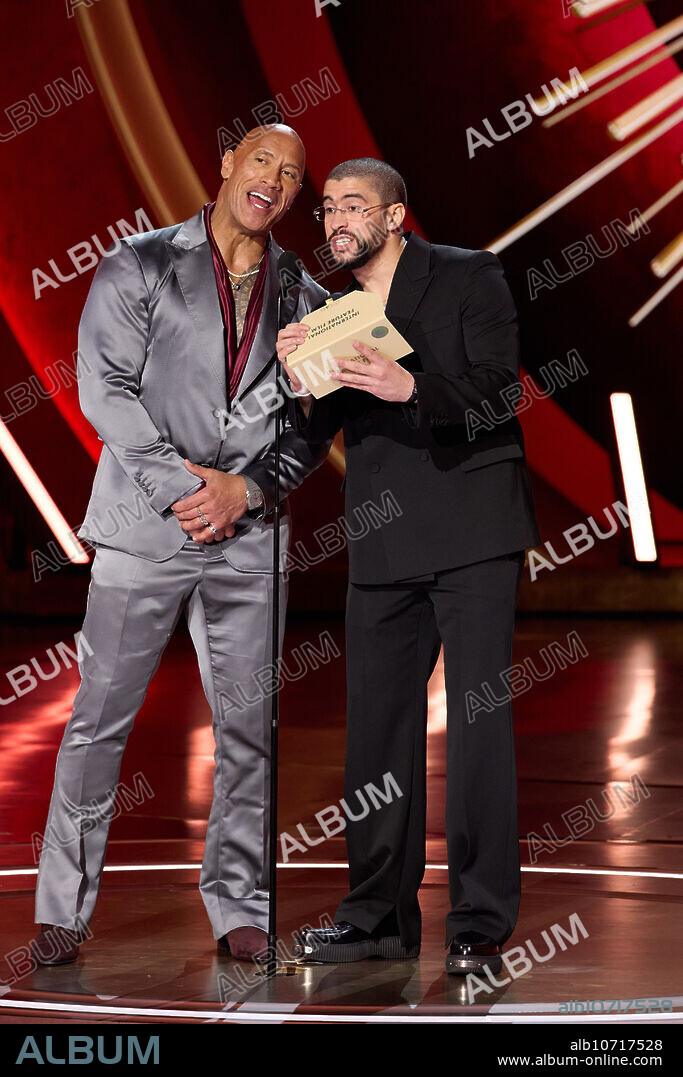 BAD BUNNY and DWAYNE "THE ROCK" JOHNSON. Dwayne Johnson and Bad Bunny present the Oscar® for International Feature Film during the live ABC telecast of the 96th Oscars® at the Dolby® Theatre at Ovation Hollywood on Sunday, March 10, 2024.