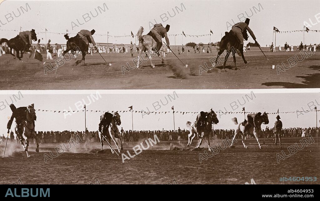 Sudan, Printed caption reads: 'Tent Pegging by Sudanese Cavalry. Published by G N Morhig, The English Pharmacy, Khartoum. Copyright 233'. A crowd of onlookers watch as four Sudanese cavalrymen of the Anglo-Egyptian army engage in a 'tent-pegging' competition. 'Tent-pegging' is a traditional cavalry sport that requires the rider to pick up small ground targets using a sword or lance whilst riding at a gallop, [c.1906]. 2003/222/1/2/17.