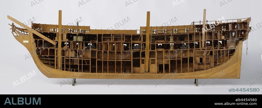 Model of an 84-Gun Ship of the Line (starboard side), Truss model of the hull (starboard side), cut lengthwise. The model is fully fired and extremely detailed. Seventy-six cannons and carronades have been preserved, the model has ninety-six gun ports spread over three decks. Five levels: cow bridge with locally lower levels, lower deck, intermediate deck, closed box and half deck with covered pit, upper campaign with two oval roses, all shot at with doors, stairs, cupboards, cages etc. The figurehead is a crowned walking man (Neptune), the galleon is decorated with sea attributes and has eight conveniences, the jibs are decorated and have lion masks. The ship has a round aft ship with wulf with two gates and a two-story fence with carvings of tendrils, corner figures and the national coat of arms, side galleries of two floors. Straight rudder with square rudder king and a brass rudder pin with retainer, no slider carriage, gutters through which the handlebar bar is guided to the steering wheel on the half deck. The model is equipped with a double anchor bet, a triple capstan, six pumps at the large mast, a large brass galley and outside all rests and damsel blocks. Inside, cross-linking (Soetermeer's system) can be distinguished. The sheer goes up to both ends, two barkwoods and one deerwood. Peaked trusses. The lower parts of the masts have been added to the model. 1:25 scale., M. van Sprinkhuizen, Rijkswerf (Rotterdam), 1837 - 1842, wood (plant material), brass (alloy), bronze (metal), ivory, rope, h 78 cm × l 273 cm × w 35 cm × w 70.5 kg.