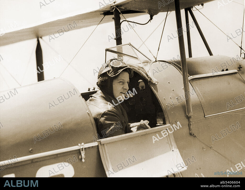 Australian aviator Freda Thompson (1909-1980), sitting in the cockpit of a De Havilland Moth Major, c 1935. Freda Thompson was the first Australian woman to fly solo from the United Kingdom to Australia.