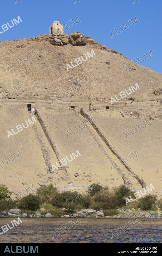 Aswan, Egypt. Qubbet el-Hawa or Dome of the Wind. Hypogean tombs dug into the hillside. They belonged to high rank officials and princes of the Old and Middle Kingdoms. A Coptic monastery was erected on the hill.