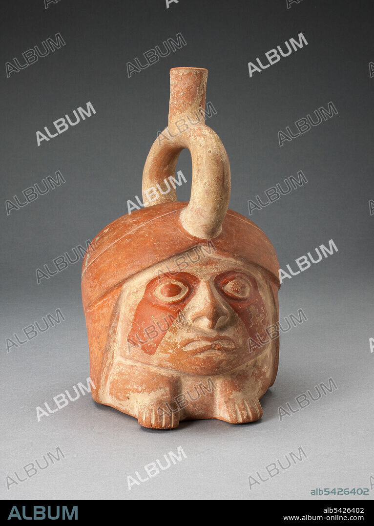 Abstract Portrait Vessel of a Ruler with Painted Face Resting on Feet, 100 B.C./A.D. 500. A head-shaped tan and red-orange ceramic vessel with a round, expressionless face atop two squat feet, darker markings around the eyes and down the cheeks.