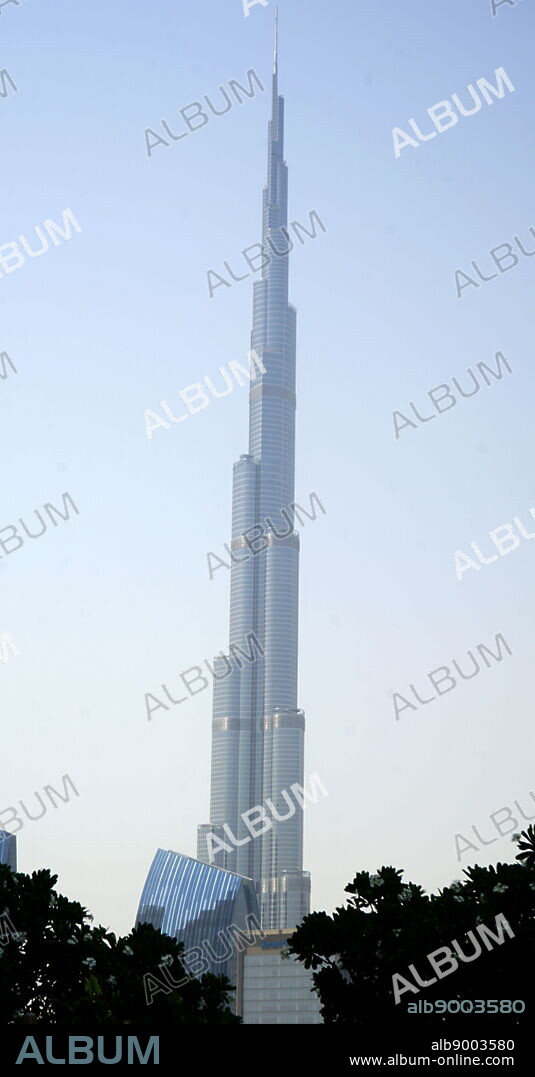 Burj Khalifa tower in Dubai, the world's tallest man-made structure. Dubai is the largest, most populous city in the United Arab Emirates (UAE). It is located on the southeast coast of the Persian Gulf and is the capital of the Emirate of Dubai, one of the seven emirates that make up the country. Dubai emerged as a global city and business hub of the Middle East.