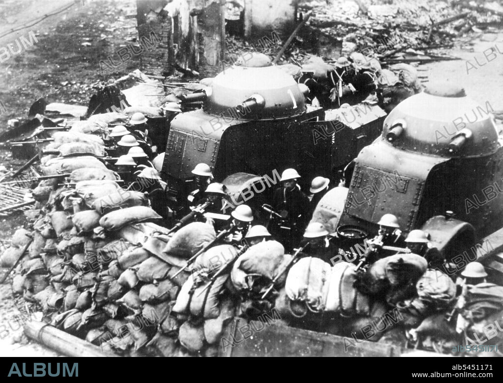 A Business-Like Barricade.A fully-Equipped Japanese bluejacket gutpost behind their Sandbag Barricade in devastated Chapel, while two armored motorcars lend the support of their Heavy machine guns. The above scene took place on February 10 shortly after the Japanese launches their heaviest attack of their drive to capture Chapel and the Woosung forts. July 3, 1932. (Photo by Associated Press Photo).