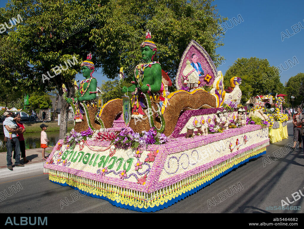 Chiang Mai is known as 'the Rose of the North', but it really blooms into flower in February, towards the end of the cool season. Every year on the first weekend of February, the Chiang Mai Flower Festival is opened. The flower beds in public spaces all around the town are especially beautiful at this time of year. Everywhere there can be found gorgeous displays of yellow and white chrysanthemums, and the Damask Rose, a variety found only in Chiang Mai. Also, the pink and purplish Dendrobium orchids, and the yellow Daoruang. The real focus of this Chiang Mai festival, however, is the public garden of Suan Buak Haad on the south-western corner of the moat. The road next to the moat all around the park is closed to traffic, and vendors of plants, Thailand flowers, Thailand orchids and garden decorations set up their stalls there.
