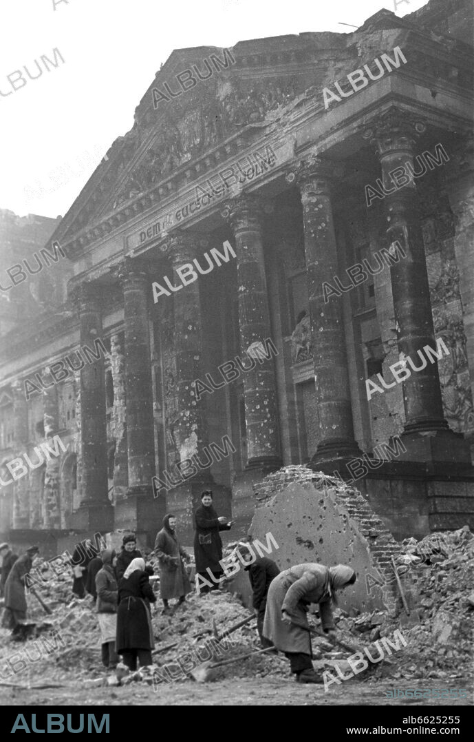 "Rubble women" during clearing works in front of the seriously damaged Reichstag building in Berlin, 1948. 1948