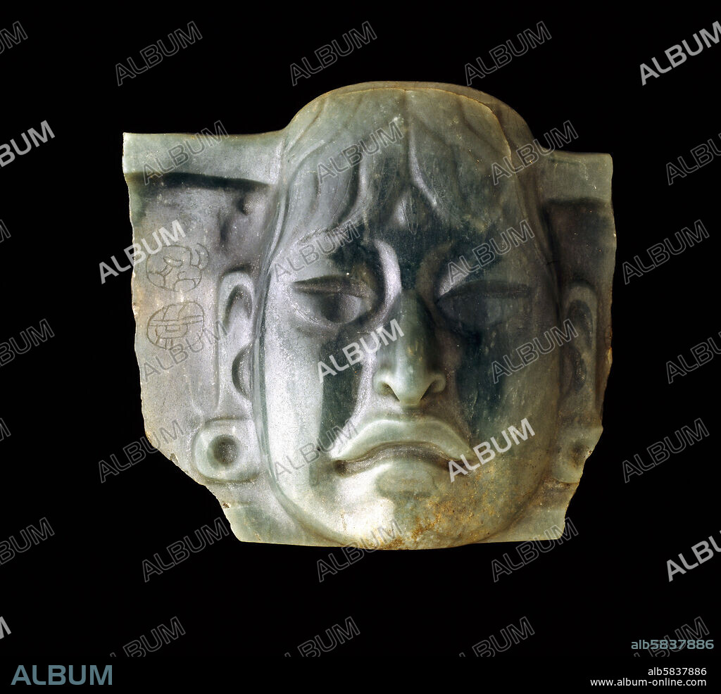 Jade pectoral, Olmec, Mexico. Middle Preclassic period (1000-600 BCE. This pectoral was carved by an Olmec artist and reused by the Maya, as shown by the two Maya glyphs on the left side. The edges framing the head indicate that it could also have been part of a larger pectoral. Olmec jade objects have been found throughout Mesoamerica and as far south as Costa Rica. Ethno, 1929.7-12.1.