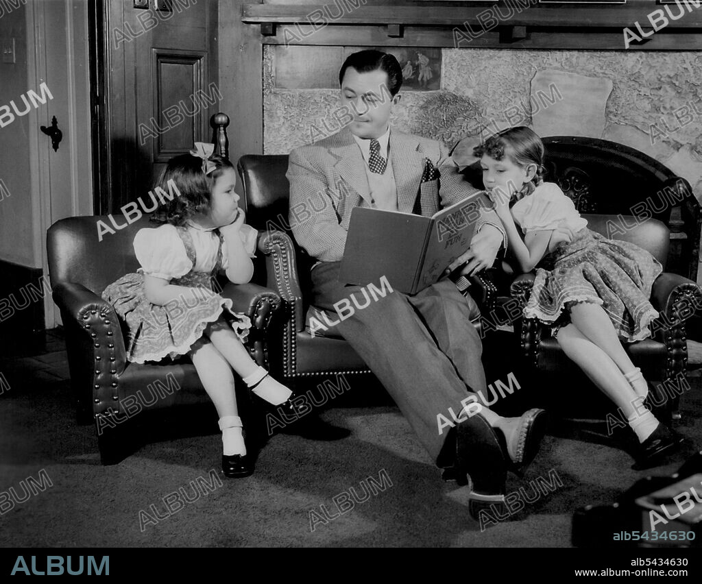 Robert Young - Devotes his time when not working in pictures to his family and home in San Fernando Valley, The actor, now appearing new Metro-Goldwyn-Wayer film with Eleanor Powell and Ann Sothern, has a seven-acre estate which is one of the showplaces of Hollywood. "Manners Can Be Fun" is the title of the book the two little Young girls hear their dad read, and the three discuss the knotty problems of deportment together. April 25, 1942.