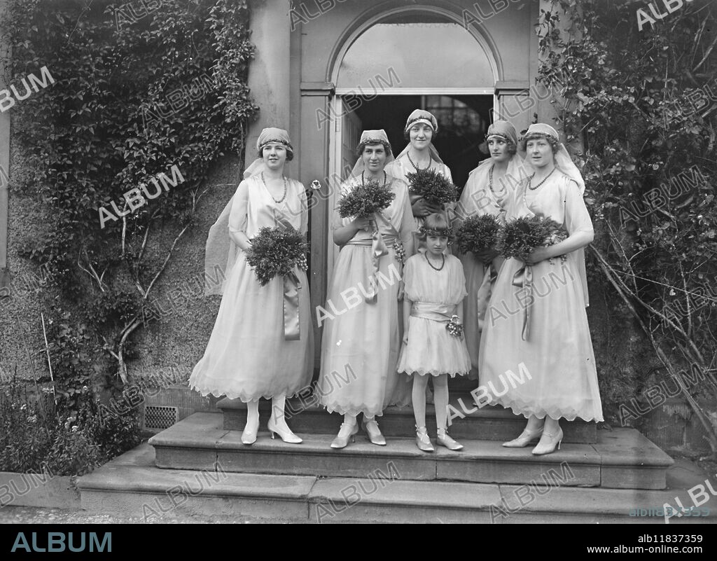 Bishop of Kingston married to the Hon Elaine Orde Powlett at Wensley . The bridesmaids - left to right : Lady Hermione Herbert , Miss Erica Gibson , Miss Catherine Talbot , Lady Winifred Cecil , Miss Beatrice Thynne . The little trainbearer in front is Lady Romayne Cecil . 19 September 1922.