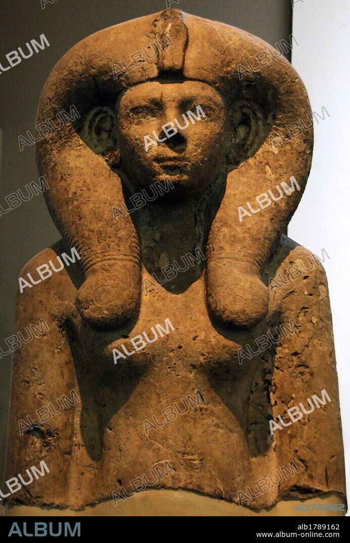 Ahmose-Merytamun. Egyptian queen and wife of Amenhotep I. Upper part of seated statue of Queen Ahmose-Merytamun wearing Hathor wig. 18th Dynasty, c. 1500 BC-1450 BC. From the Temple of Amun, Karnak (Thebes).  Limestone. British Museum. London, England, United Kingdom.