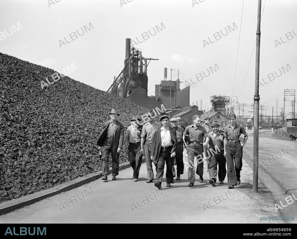 Change of shift at steel mill, Aliquippa, Pennsylvania, USA, Arthur Rothstein, U.S. Farm Security Administration, July 1938.