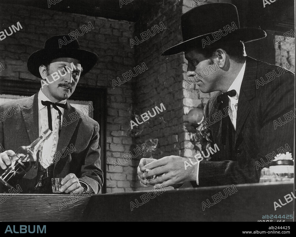 BURT LANCASTER and KIRK DOUGLAS in GUNFIGHT AT THE O. K. CORRAL, 1957, directed by JOHN STURGES. Copyright PARAMOUNT PICTURES.