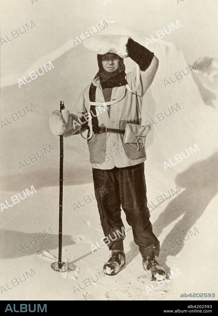 'Captain Scott Wearing The Wallet in Which He Carried His Sledging Journals', c1910-1911, (1913). The final expedition of British Antarctic explorer Captain Robert Falcon Scott (1868-1912) left London on 1 June 1910 bound for the South Pole. The Terra Nova Expedition, officially the British Antarctic Expedition (1910-1913), included a geologist, a zoologist, a surgeon, a photographer, an engineer, a ski expert, a meteorologist and a physicist among others. Scott wished to continue the scientific work that he had begun when leading the Discovery Expedition to the Antarctic in 1901-04. He also wanted to be the first to reach the geographic South Pole. Scott, accompanied by Dr Edward Wilson, Captain Lawrence Oates, Lieutenant Henry Bowers and Petty Officer Edgar Evans, reached the Pole on 17 January 1912, only to find that the Norwegian expedition under Amundsen had beaten them to their objective by a month. Delayed by blizzards, and running out of supplies, Scott and the remainder of his team died at the end of March. Their bodies and diaries were found eight months later. From Scott's Last Expedition, Volume I. [Smith, Elder & Co., London, 1913].