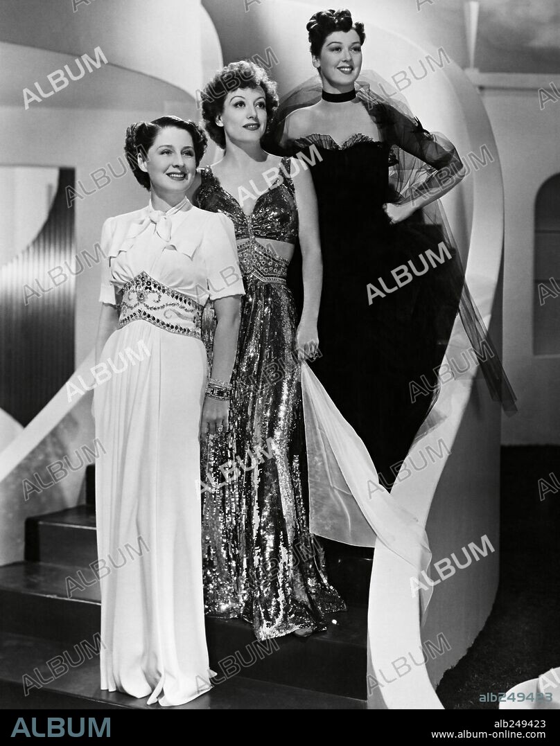 JOAN CRAWFORD, NORMA SHEARER and ROSALIND RUSSELL in THE WOMEN, 1939, directed by GEORGE CUKOR. Copyright M.G.M. Custome by Adrian.