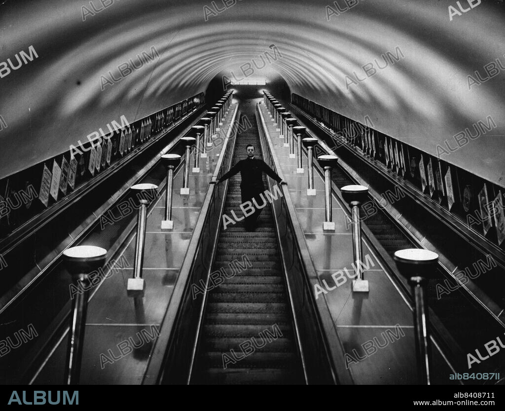 World's Largest Escalators -- The Leicester-Square Underground Escalator.***** convenience of the 25,000,000 passengers who use Leicester-Square Underground Station during the year, it has been transformed.It will be opened to the public who will have the pleasure of being carried into the depths on the longest and largest escalator in the world, measuring 161 feet in length, and 80ft. 6ins. in height. June 11, 1935. (Photo by Universal Pictorial Press & Agency).