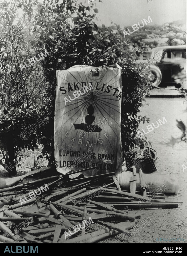Siezed after Sakdalista uprising.... These weapons and flag of the Sakdalistas, extremist political organisation of the Philippines, were seized (may 4) at San 
Ildefonso Bulacan province, North of Manila, after the Constabulary recaptured the town hall. Copies of the Sakdal, the party newspaper, which had been barred from the Mails, were also confiscated. May 28, 1935. (Photo by Associated Press Photo).