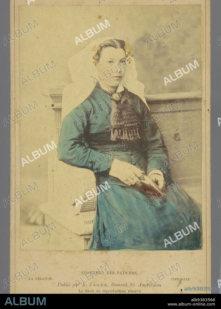 Portrait of an unknown woman with headdress according to the costume of Zierikzee, Zeeland, La Zélande. Zierikzee (title on object), Costumes des Pays-Bas (series title on object), Andries Jager (possibly), publisher: Andries Jager (mentioned on object), Amsterdam, 1860 - 1890, cardboard, albumen print, height 168 mm × width 108 mm.