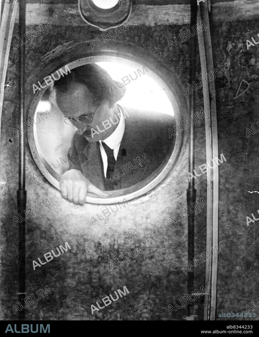 New Belgian Stratosphere Balloon -- Prof. Piccard can be seen at the Porthole of the gondola.Professor Auguste Piccard yesterday inspected the new stratosphere balloon in which Dr. Cosyns and a companion hope to a second into the stratosphere shortly. The balloon is being prepared at the Brussels University.As he looked out the gondola porthole of his balloon Professor Piccard said he was going up "twice as high as Everest". That's what he did. March 14, 1934. (Photo by Keystone).