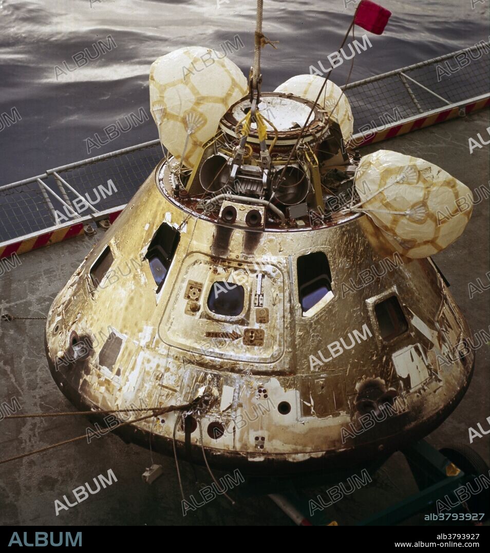 This is a photograph of the Apollo 8 Capsule being hoisted onto the recovery ship following splashdown on December 27, 1968. The first manned Apollo mission to escape Earth's gravity and travel to the lunar vicinity, the Saturn V, SA-503, Apollo 8 mission liftoff occurred seven days prior, on December 21, 1968. Aboard were astronauts William Anders, Lunar Module (LM) Pilot; James Lovell, Command Module (CM) pilot; and Frank Borman, commander. The mission achieved operational experience and tested the Apollo command module systems, including communications, tracking, and life-support, in cis-lunar space and lunar orbit, and allowed evaluation of crew performance on a lunar orbiting mission. The crew photographed the lunar surface, both far side and near side, obtaining information on topography and landmarks as well as other scientific information necessary for future Apollo landings. All systems operated within allowable parameters and all objectives of the mission were achieved. 12.27.1968.
