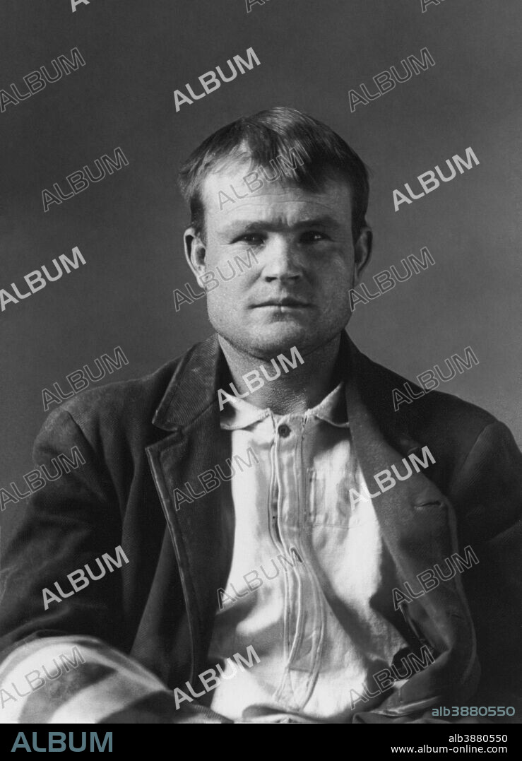Vintage American history photo of Butch Cassidy in a mugshot taken at Wyoming Territorial Prison, 1894.