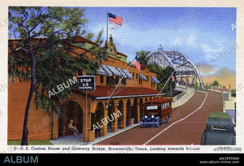 US Customs House and Gateway Bridge, Brownsville, Texas, USA, 1940. View of the Customs House and Gateway Bridge looking towards Mexico. A bus is parked in front of the building.
