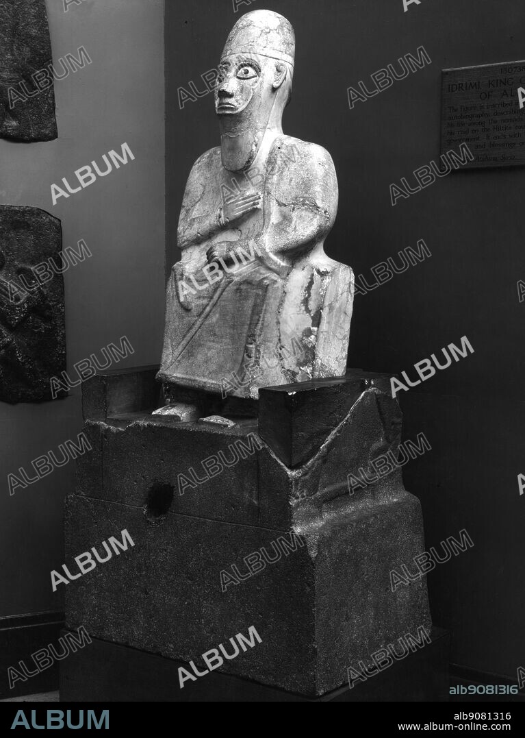 Idrimi, King of Alalah - statue of Ydrimi -. Idrimi was the king of Alalakh in the first half of the 15th century BC -. Alalakh, or Alalah, is the name of an ancient city and its associated city-state of the Amuq River valley, located in the Hatay region of southern Turkey near the city of Antakya (ancient Antioch), and now represented by an extensive city-mound known as Tell Atchana -. It is probable that in the first half of the 15th century, Idrimi, son of the king of Aleppo may have fled his city for Emar, traveled to Alalakh, gained control of the city, and been recognized as a vassal by Barattarna. The inscription records Idrimi's vicissitudes: after his family had been forced to flee to Emar, he left them and joined the "Hapiru people" in "Ammija in the land of Canaan", where the Hapiru recognized him as the "son of their overlord" and "gathered around him"; after living among them for seven years, he led his Habiru warriors in a successful attack by sea on Alalakh, where he became king. ©TopFoto.