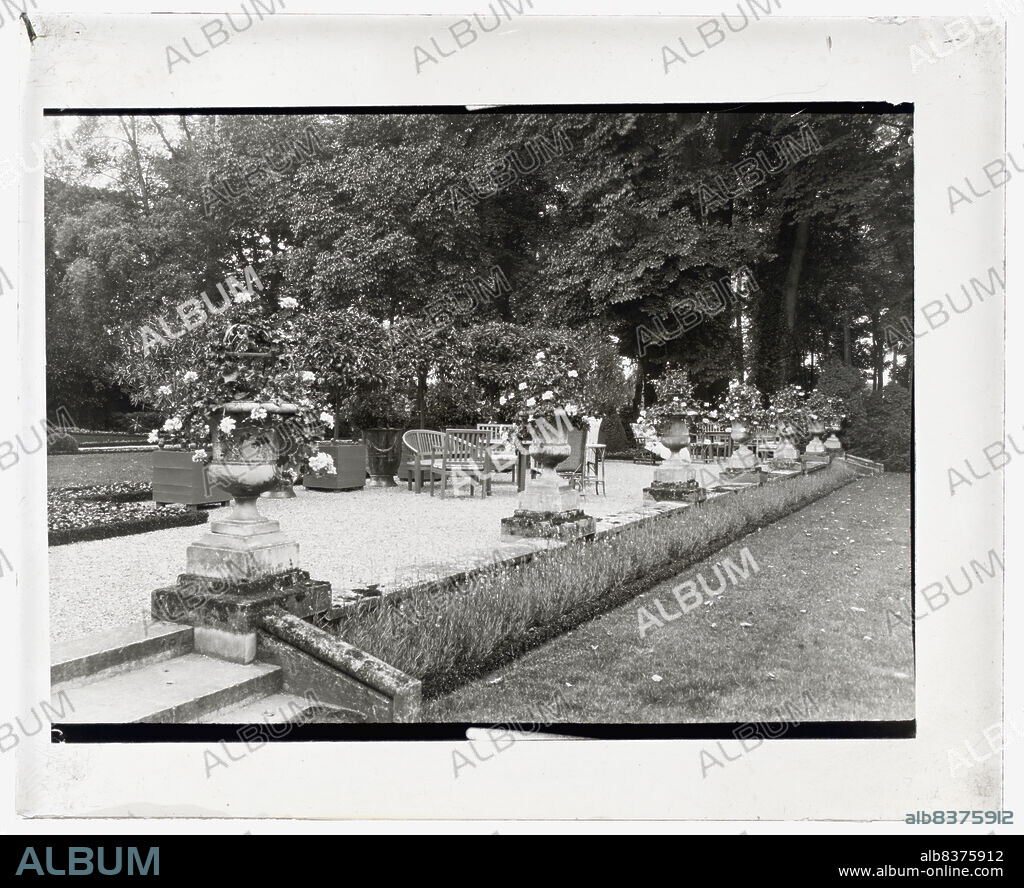 FRANCES BENJAMIN JOHNSTON. Pavillon Colombe, Edith Jones Wharton house, 33 rue Edith Wharton, St. Brice-sous-Fore^t, Seine-et-Oise, France, 1925. House architecture: Franc¸ois Be´langer, built 1769; with alternations by Charles Moreux and Henri Gonse for Edith Wharton 1918-1919. Landscape: Lawrence Johnston for Edith Wharton, 1918-1919. ['Shaded gravelled terrace, screened by orange trees, with chaise lounges [sic], settees and tables, at Mrs. Edith Wharton's villa, St. Brice-sous-Forêt'].