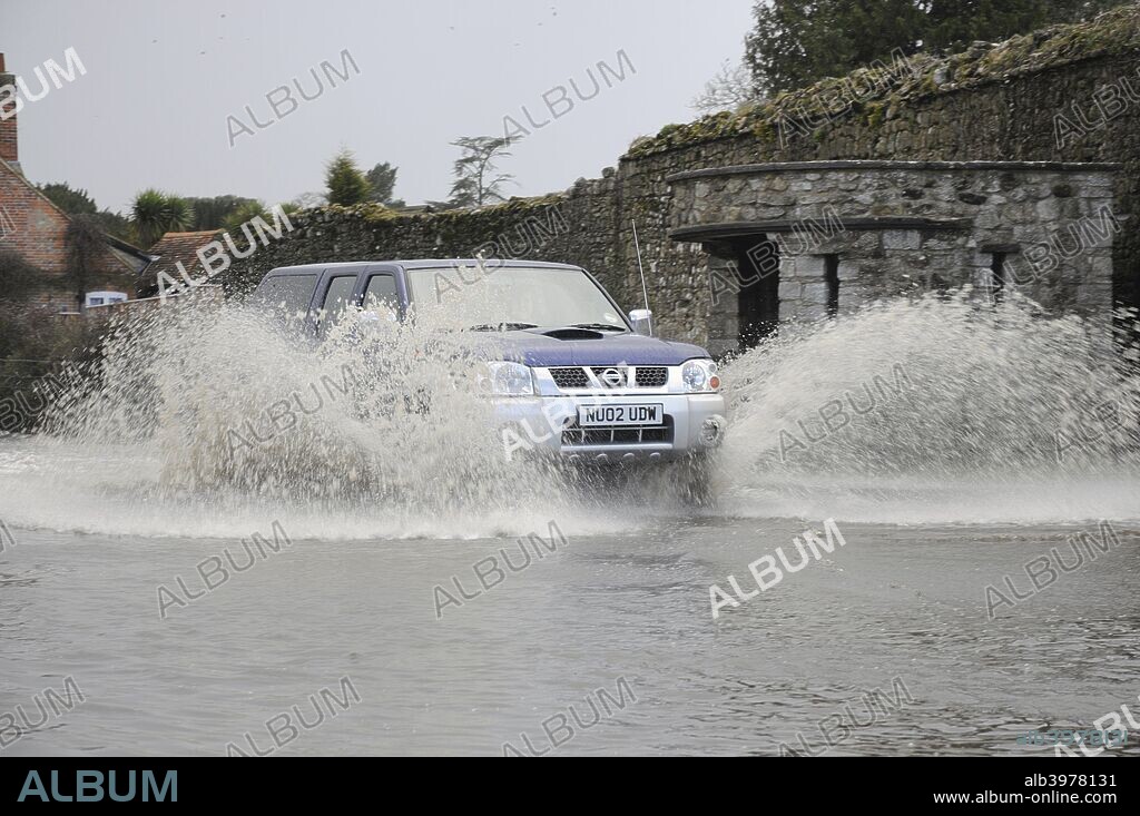 Nissan Pick up truck on Flooded road at Beaulieu, Hampshire, 2008.