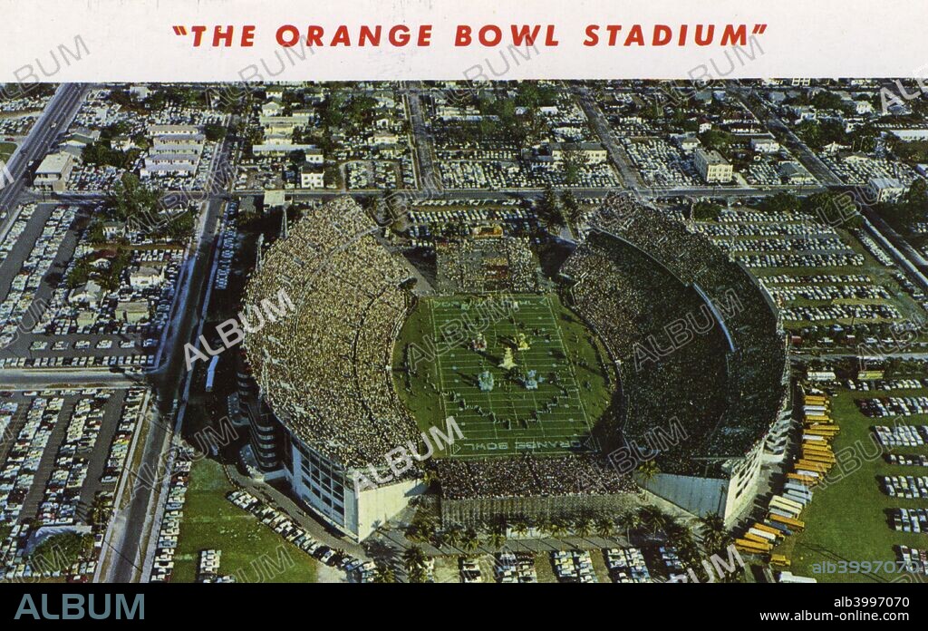 Orange Bowl Stadium, Miami, Florida, USA, 1958. Vintage postcard showing a bird's eye view of the stadium and the surrounding parking areas. Opened in 1937, the Miami Orange Bowl was the home stadium of the American Football team of the University of Miami, the Miami Hurricanes. Until 1995 it also hosted the annual Orange Bowl game, one of the premier end of season bowl games in college football. From 1966 until 1986 the stadium was also home to the Miami Dolphins, the city's National Football League (NFL) team and hosted four Super Bowls. The Orange Bowl closed in January 2008 and was demolished shortly afterwards.