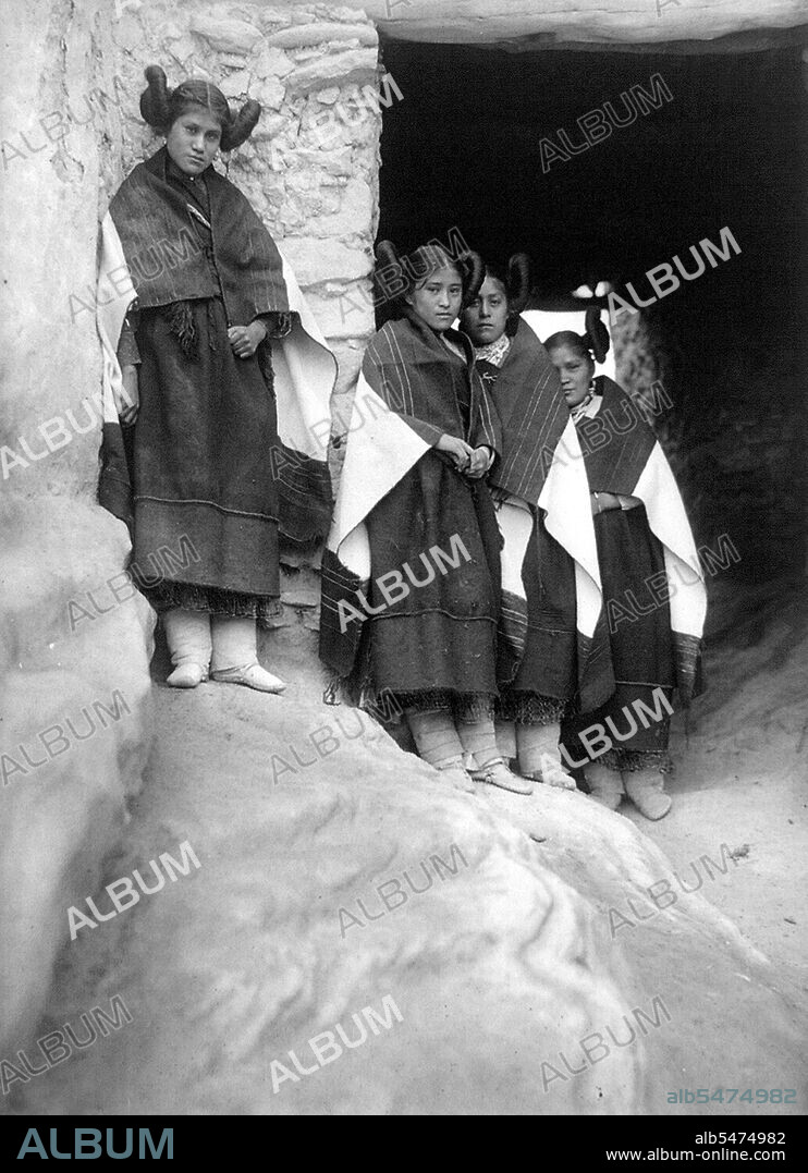 Edward S. Curtis Native American Indians - Walpi maidens--Hopi with unique hair fashion circa 1906.