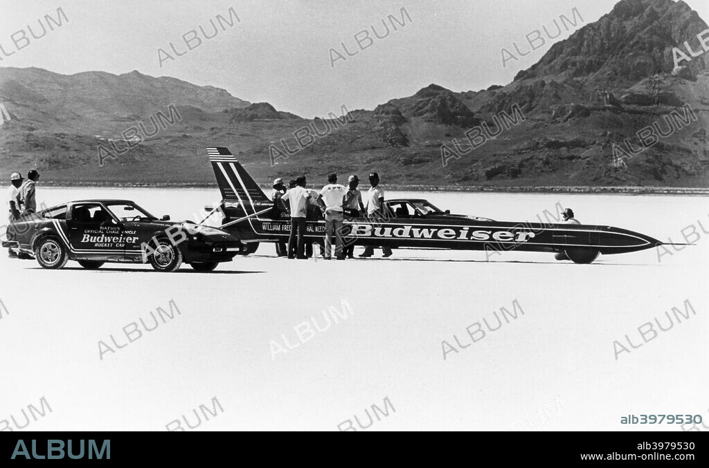Budweiser Rocket, USA, 1979. This rocket-powered vehicle designed by William Frederick was calculated as having been driven by Stan Barrett at 739.666 mph at Edwards Air Force Base in California. It was not accepted as a new Land Speed Record, however, as the attempt fell foul of several of the strict rules governing Land Speed Record attempts. The vehicle made only one run, where the rules stipulate that two must be made, in opposite directions, within an hour of each other. In addition there were doubts over the accuracy of the procedure used for measuring the speed, as well as the observers not being the impartial officials required under the rules. Controversy also surrounded the team's claim that they had broken the sound barrier for the first time on land, with spectators saying they had heard no sonic boom. This feat was officially recognised as having been performed by the British Thrust SSC vehicle driven by Andy Green in the Black Rock Desert, Nevada, in 1997.