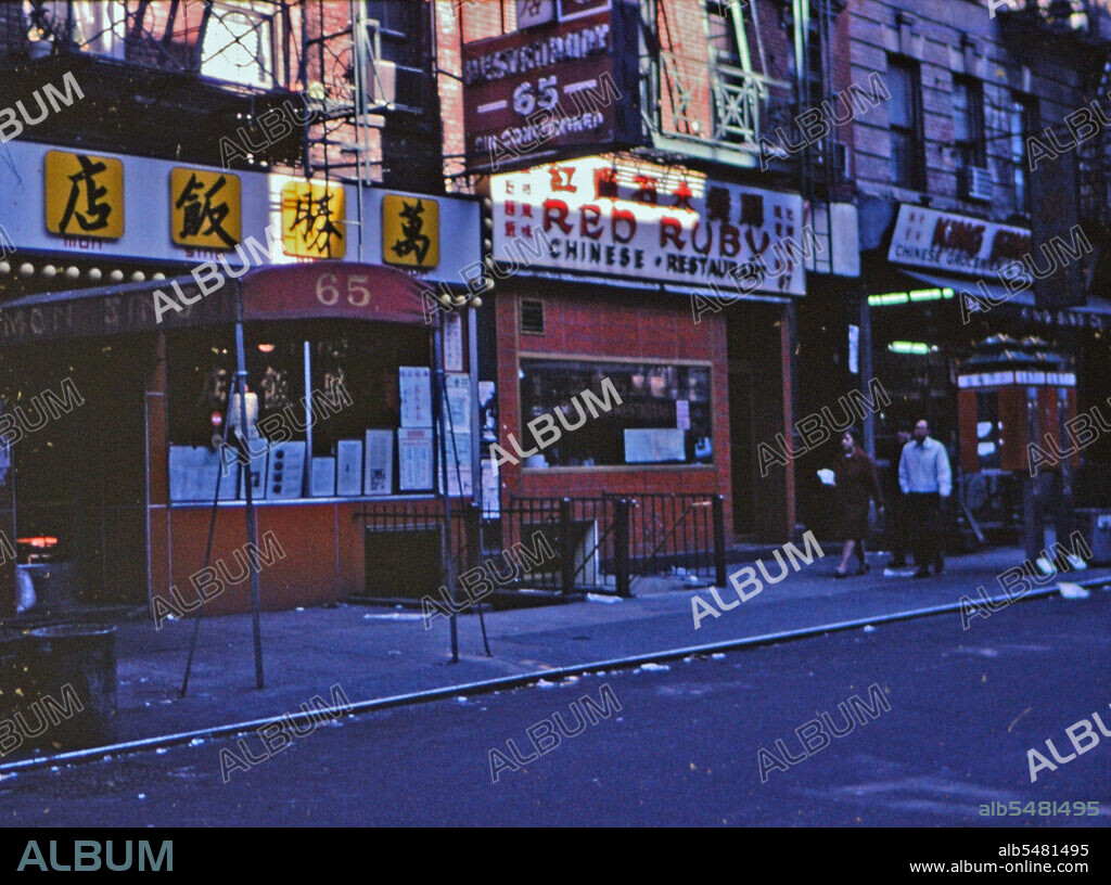 (R) New York 1975 - Red Ruby Chinese Restaurant and other businesses in the Chinatown area of New York City. Red Ruby became Big Wong Restaurant in 1978. This photo is Mott Street in Chinatown..