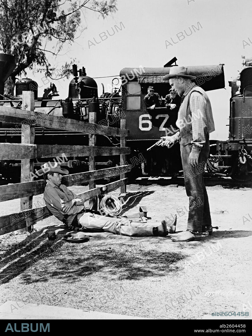 JAMES COBURN and ROBERT J. WILKE in THE MAGNIFICENT SEVEN, 1960, directed by JOHN STURGES. Copyright UNITED ARTISTS.