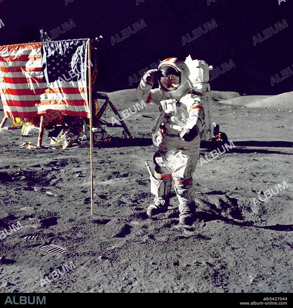 HARRISON SCHMITT. Cernan Jump Salutes Flag, 1972. Eugene A. Cernan, Commander, Apollo 17, salutes the US flag on the lunar surface during extravehicular activity (EVA) on NASA's final lunar landing mission. The Lunar Module "Challenger" is in the left background behind the flag and the Lunar Roving Vehicle (LRV) also in background behind him. While astronauts Cernan and Schmitt descended in the Challenger to explore the Taurus-Littrow region of the Moon, astronaut Ronald E. Evans, Command Module pilot, remained with the Command/Service Module (CSM) "America" in lunar-orbit.