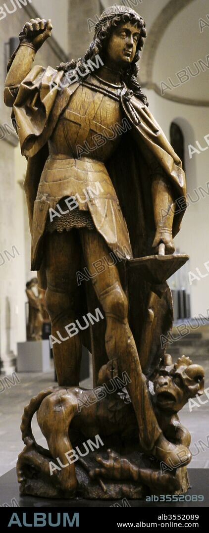 San Miguel Arcangel luchando contra Satanás. Hacia el 1500. Madera de roble. Departamento de Mosa, Francia. Museo Schnütgen. Colonia, Alemania.