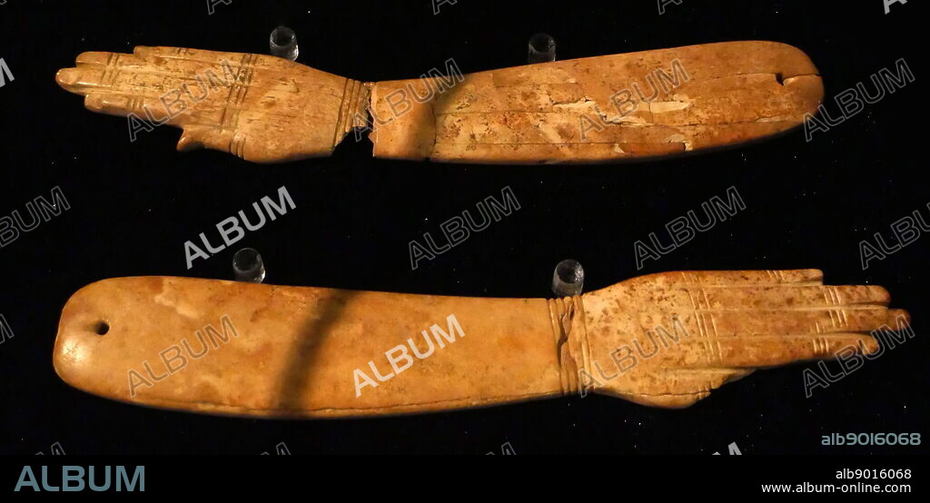 Clappers used as musical instruments which granted protection through their sound.