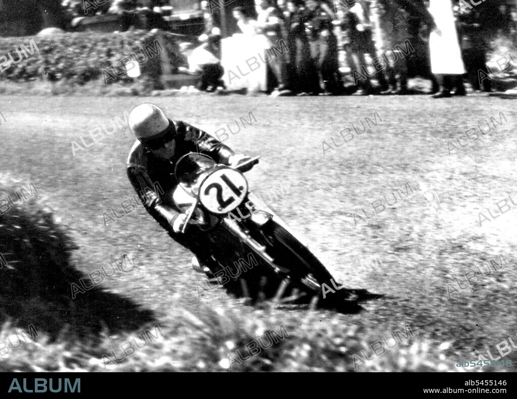 Ulster Grand Prix 500 C.C. Winner -- Ken Kavanagh won the 500 C.C. Race.
Ken Kavanagh riding a Norton Motor Cycle flashing around the corner at Cochranestown. Yesterday. August 16, 1953. (Photo by Paul Popper Photo).