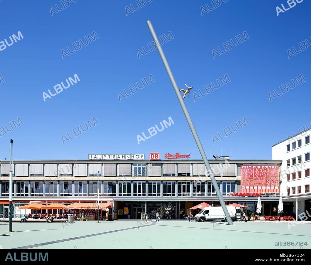 Sculpture Man walking to the sky, Himmelsstürmer, designed in 1992 by Jonathan Borofsky documenta 9, in front of the Kulturbahnhof, central railway station, Kassel, Hesse, Germany, Europe.