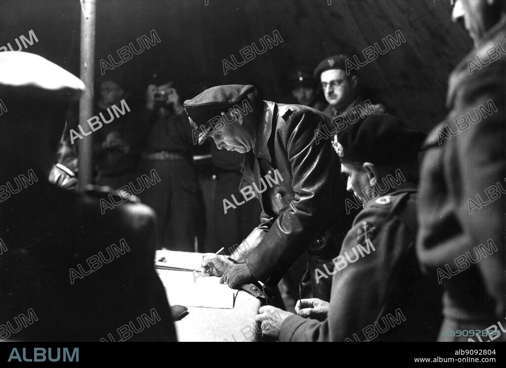 WW2: Admiral Armin Vin *(sic), Friedeburg. Supreme Commander of the German Navy, signing the surrender, 4th May 1945. Field Marshal Montgomery sits to the left of him.