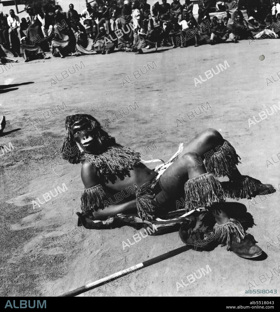 "Look Out For Natives: - Skin-Deep Civilization In Johannesburg, South Africa.Zulu dance in native miners' compound. Some of the dances require grotesque masks. March 26, 1938. (Photo by Pix Publishing Inc.).