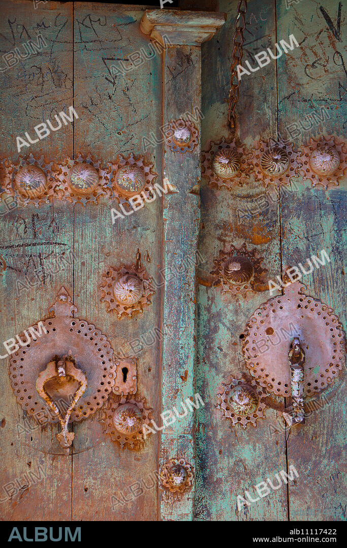 Male (right) and female door knockers giving different sounds to ensure the right gender person receives the guest, Abyaneh, Iran, Middle East.