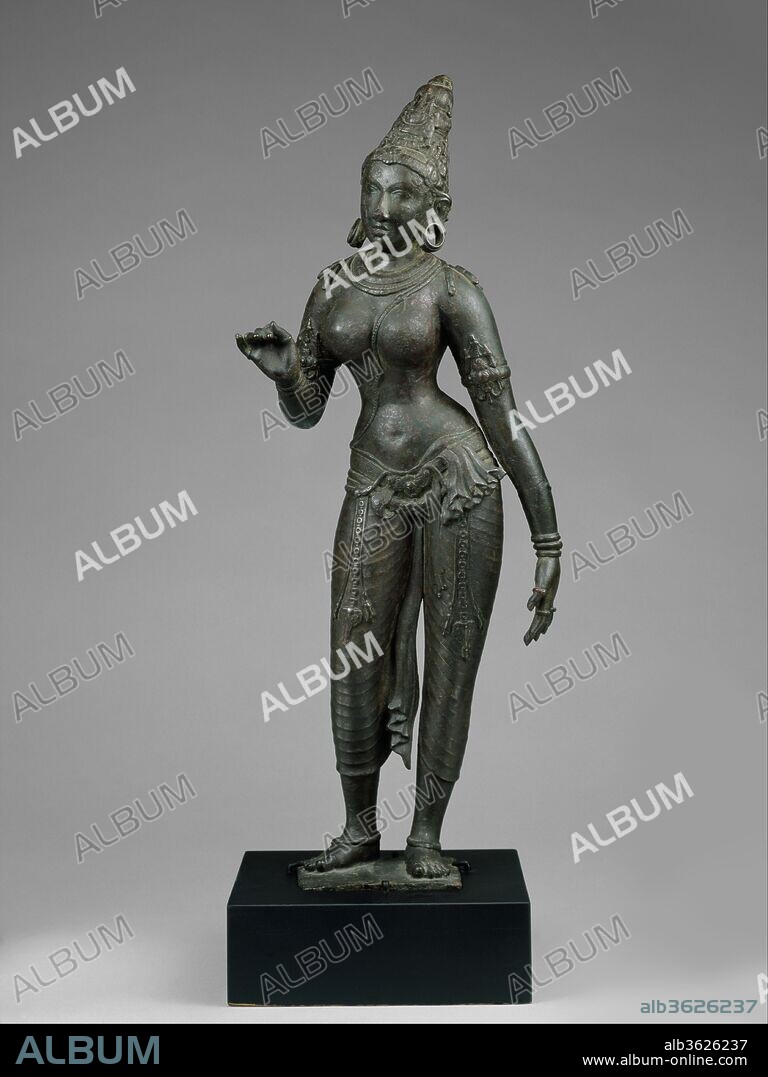 Standing Parvati. Culture: Indian (Tamil Nadu). Dimensions: H. 27 3/8 in. (69.5 cm). Date: ca. first quarter of the 10th century.
Parvati is the consort of Shiva and mother of the elephant-headed god Ganesha. This magnificent statue is one of the finest Chola representations of Parvati found outside India. The genius and obvious skill of the sculptor produced a timeless image of the goddess as well as a female figure of surpassing beauty and grace. Her lyrical, rhythmic carriage and the soft yet firm lines of her body suggest the ideal of the divine and eternal female.