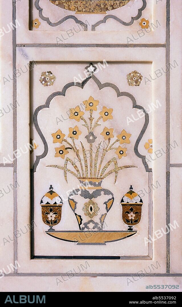 Pietra dura or pietre dure (see below), called parchin kari in South Asia, is a term for the inlay technique of using cut and fitted, highly-polished colored stones to create images. Etimad-ud-Daula's Tomb (Urdu: ?????? ?????? ?? ??????, I'timad-ud-Daulah ka Maqbara) is a Mughal mausoleum in the city of Agra in the Indian state of Uttar Pradesh. Along with the main building, the structure consists of numerous outbuildings and gardens. The tomb, built between 1622 and 1628 represents a transition between the first phase of monumental Mughal architecture - primarily built from red sandstone with marble decorations, as in Humayun's Tomb in Delhi and Akbar's tomb in Sikandra - to its second phase, based on white marble and pietra dura inlay, most elegantly realized in the Taj Mahal. The mausoleum was commissioned by Nur Jahan, the wife of Mughal emperor Jahangir, for her father Mirza Ghiyas Beg, originally a Persian Amir in exile, who had been given the title of I'timad-ud-Daulah (Pillar of the State). Mirza Ghiyas Beg was also the grandfather of Mumtaz Mahal (originally named Arjumand Bano, daughter of Asaf Khan), the wife of the emperor Shah Jahan, responsible for the construction of the Taj Mahal.