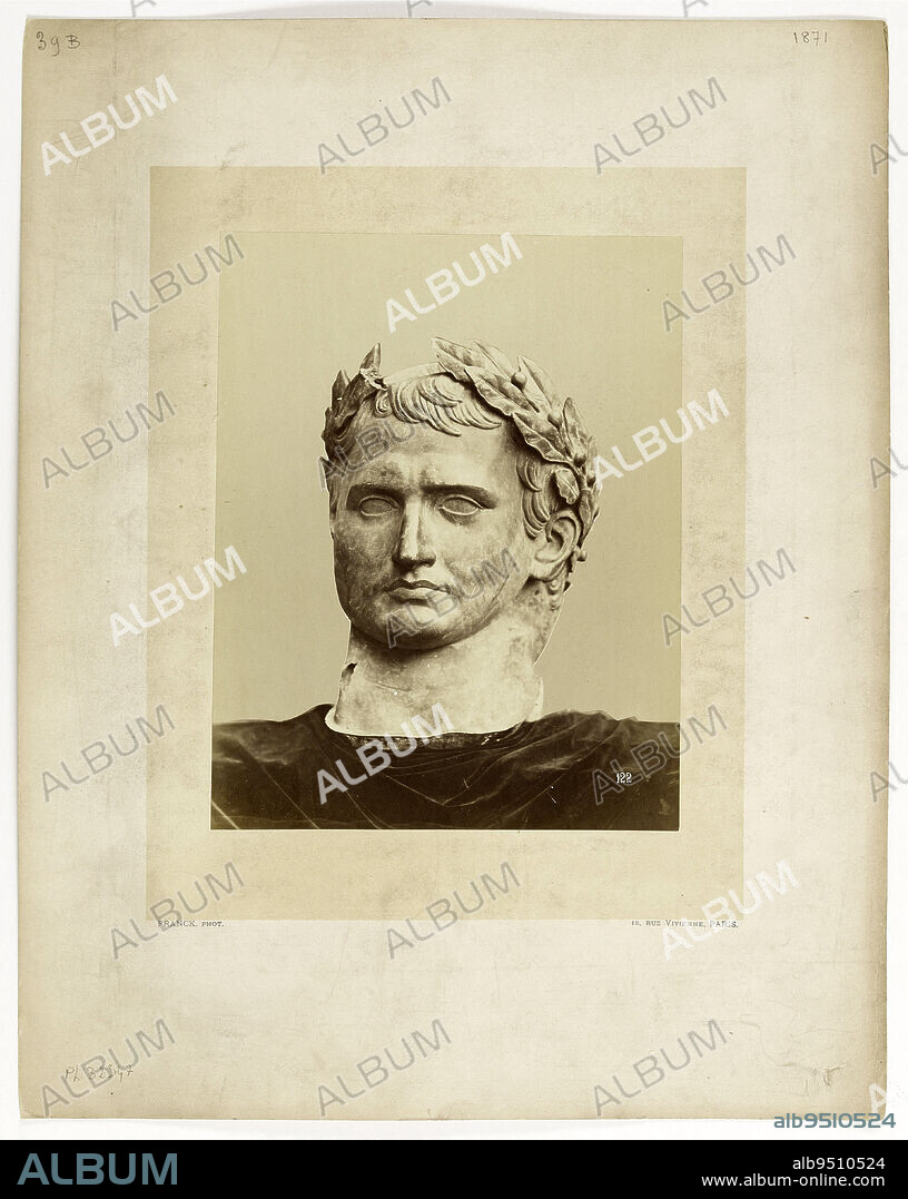 Sculpture of the head of Napoleon I (as a Roman emperor), photographed on a cloth, after the destruction of the Vendôme column during the Paris Commune by the communards on May 16, 1871. Statue by Antoine-Denis Chaudet (1763-1810 ), 1st..., Franck (François Gobinet de Villechole, dit), Photographer, 1871, Graphic arts, Photography, Albumen paper print, Paris, Dimensions - Work: Height: 24 cm, Width: 18.7 cm, Dimensions - Montage: Height: 44 cm, Width: 34.7 cm, Dimensions: Height:  cm, Width:  cm.