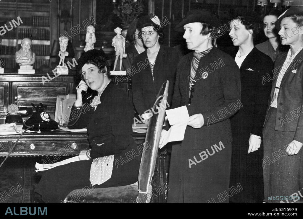 Londonderry House -- Recruiting Depot For Woman -- Lady Londonderry (seated with 'phone) with recruits at Londonderry House.
A rapid transformation has taken place at Londonderry house, park lane. Rooms in which royalty, statesman and diplomats are entertained have been turned by lady Londonderry into a recruiting depot for woman transport drivers. Lady Londonderry is in charge of the recruiting programme.
It is being carried out by the woman's legion, started during the great war and retained ever since on a reserve basis. September 29, 1938.