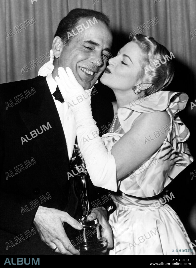 CLAIRE TREVOR and HUMPHREY BOGART. The 24th Academy Awards / 1952. 
Best Actor winner for 'The African Queen', with presenter Claire Trevor. 1952