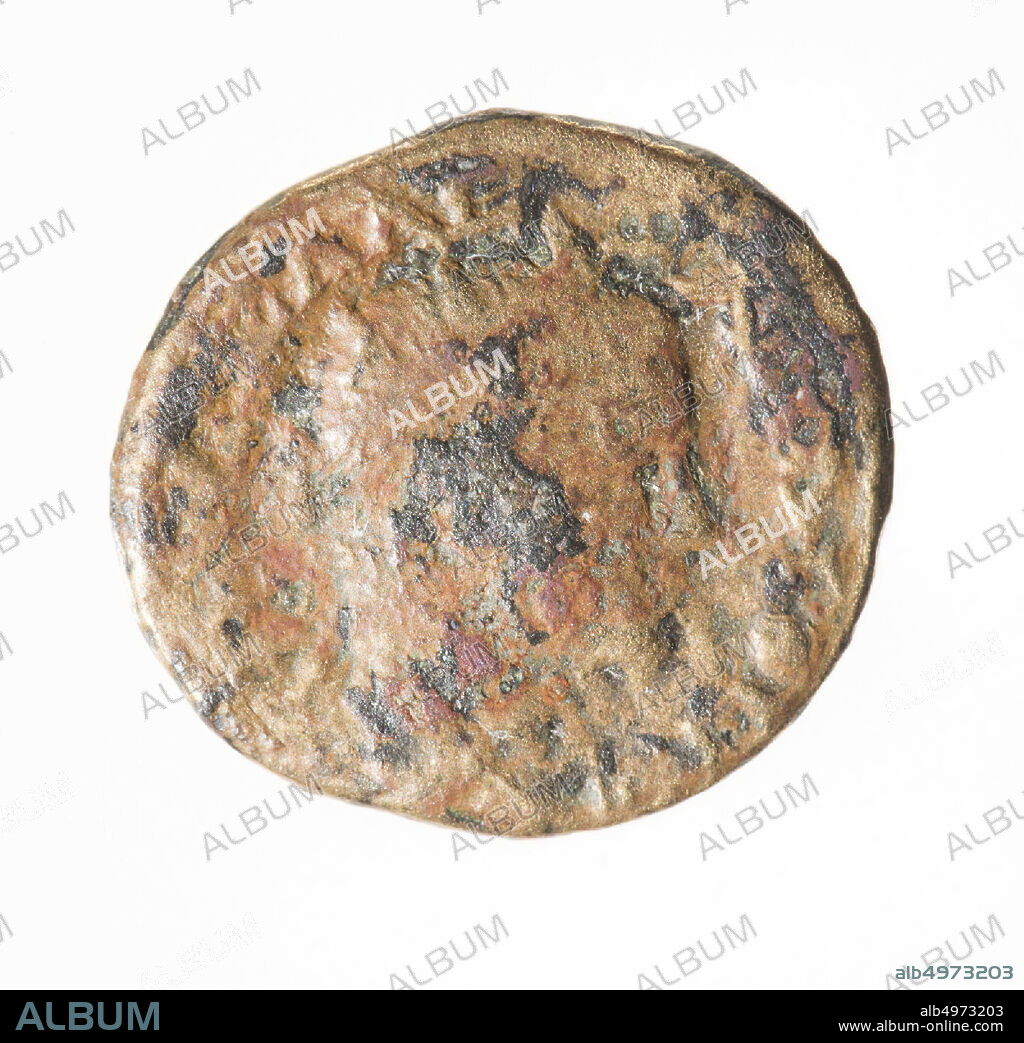 Obverse: Severus Alexander, right, with radiator crown. Worn with remains of Greek inscription. Reverse: Three banners with the inscription in between: N-IK-AI-E and below: WN. Middle banner carries two spheres, outer one., Coin, of Severus Alexander, metal, bronze, diam: 1.9 cm, wt. 3.8 grams, 222-235 AD, unknown.