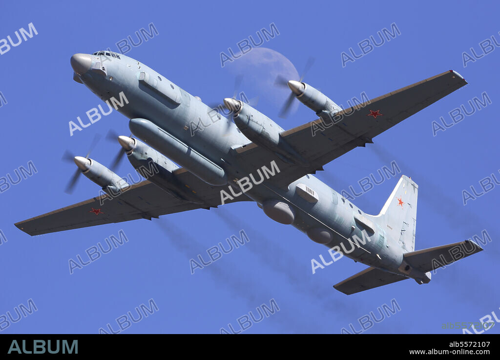 IL-20M reconnaissance aircraft of the Russian Air Force in flight in front of the moon, Zhukovsky, Russia.